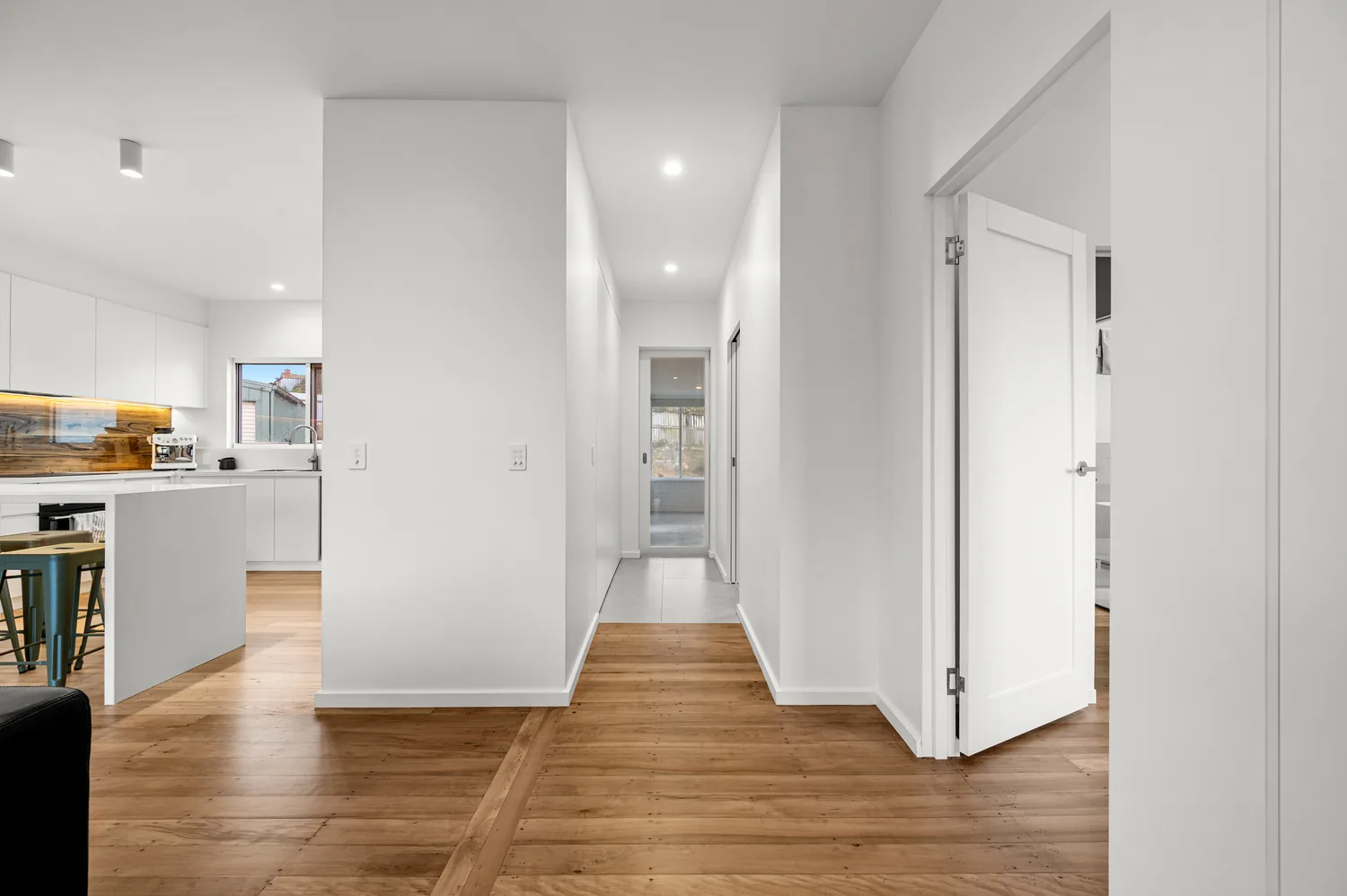 Whole-home renovation with open-plan kitchen and timber flooring