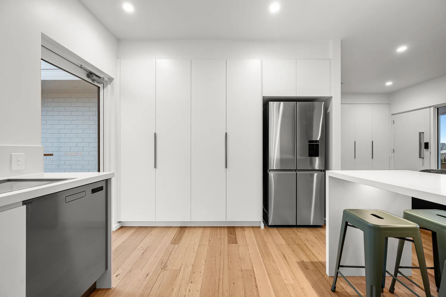 Open-plan kitchen renovation with island bench and timber flooring